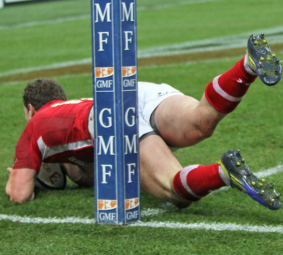 Wales' George North squeezes over in the corner for a try
