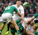 Ireland's Rob Kearney offloads from the deck