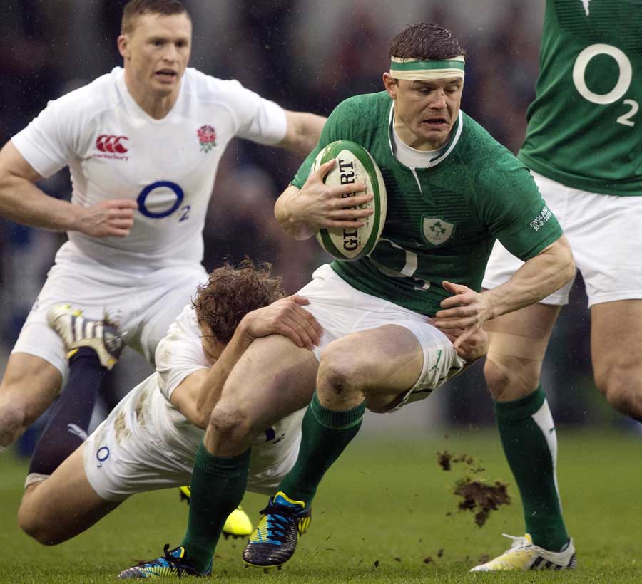 Ireland's Brian O'Driscoll tries to break away from the tackler