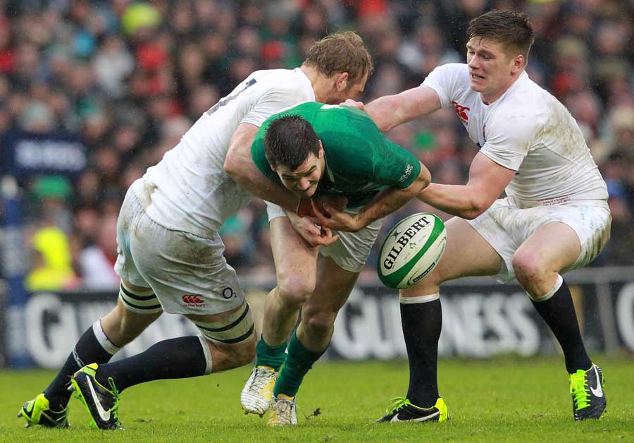 Ireland's Jonathan Sexton spills the ball forward