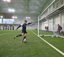 England's Owen Farrell practises his kicking indoors at St George's Park