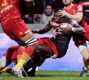 Toulouse's Yves Donguy is felled by the Perpignan defence