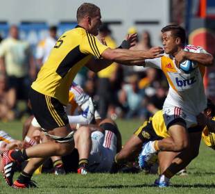Tim Nanai-Williams of the Chiefs fends off James Broadhurst of the Hurricanes, Chiefs v Hurricanes, Super Rugby warm-up match, Mangatainoka, New Zealand, February 16, 2013