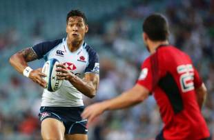 Israel Folau of the Waratahs takes on the defence during the Super Rugby trial match against the Crusaders at Allianz Stadium in Sydney on February 14, 2013