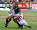 South Africa's Renfred Dazel is tackled by the USA's James Gillenwater 