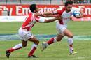 England's Ben Gollings is tackled by Tunisia's Mohamed Gara Ali