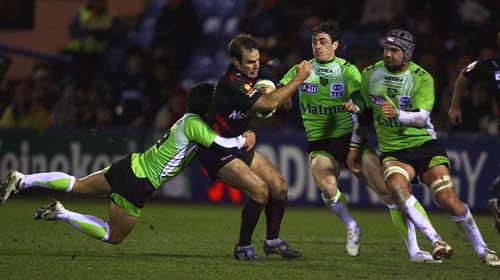Charlie Hodgson is tackled by the Montauban defence
