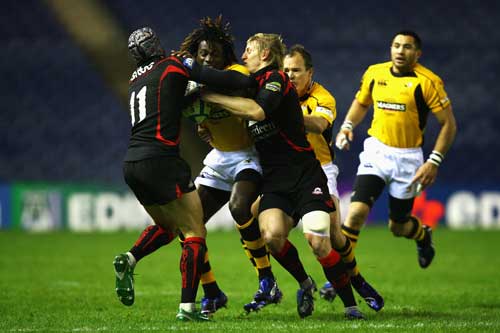 Wasps winger Paul Sackey crashes into the Edinburgh defence