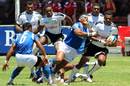 Samoa's Apelu Fa'aiuga tackles Fiji's Seremaia Burotu 