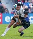 Castres Olympique's Charles Sika is tackled by Leinster's Simon Keogh 