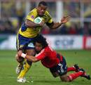 Clermont's Seremaia Bai is tackled by Munster's Lifeimi Mafi