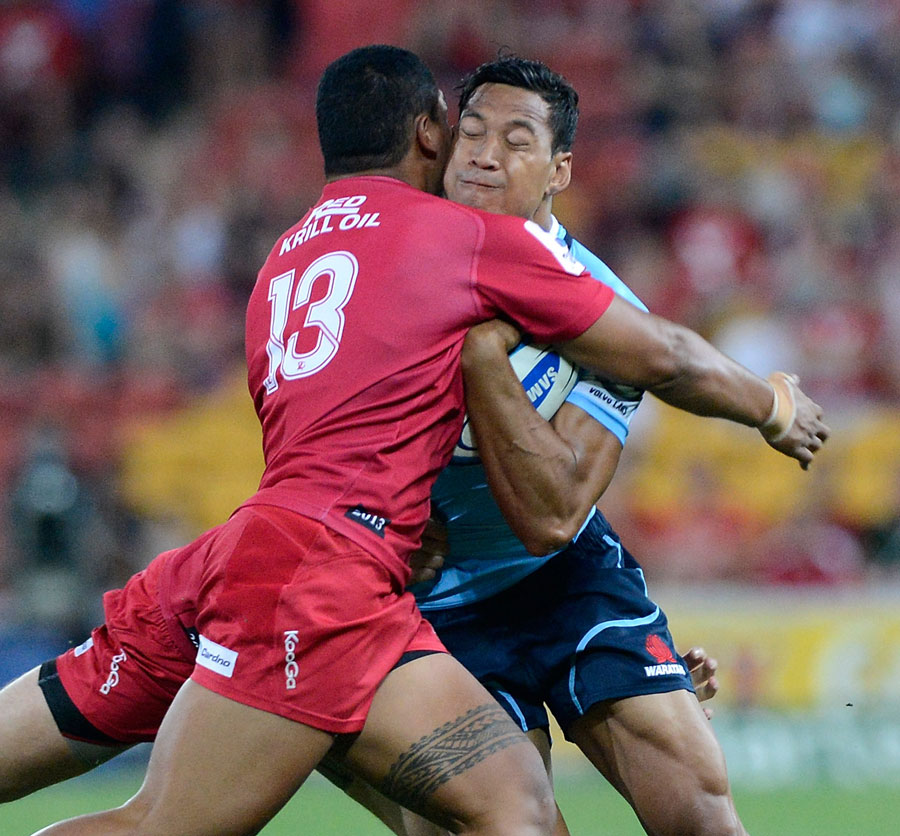NSW Waratah's Israel Folau is wrapped up by the Queensland Reds' defence