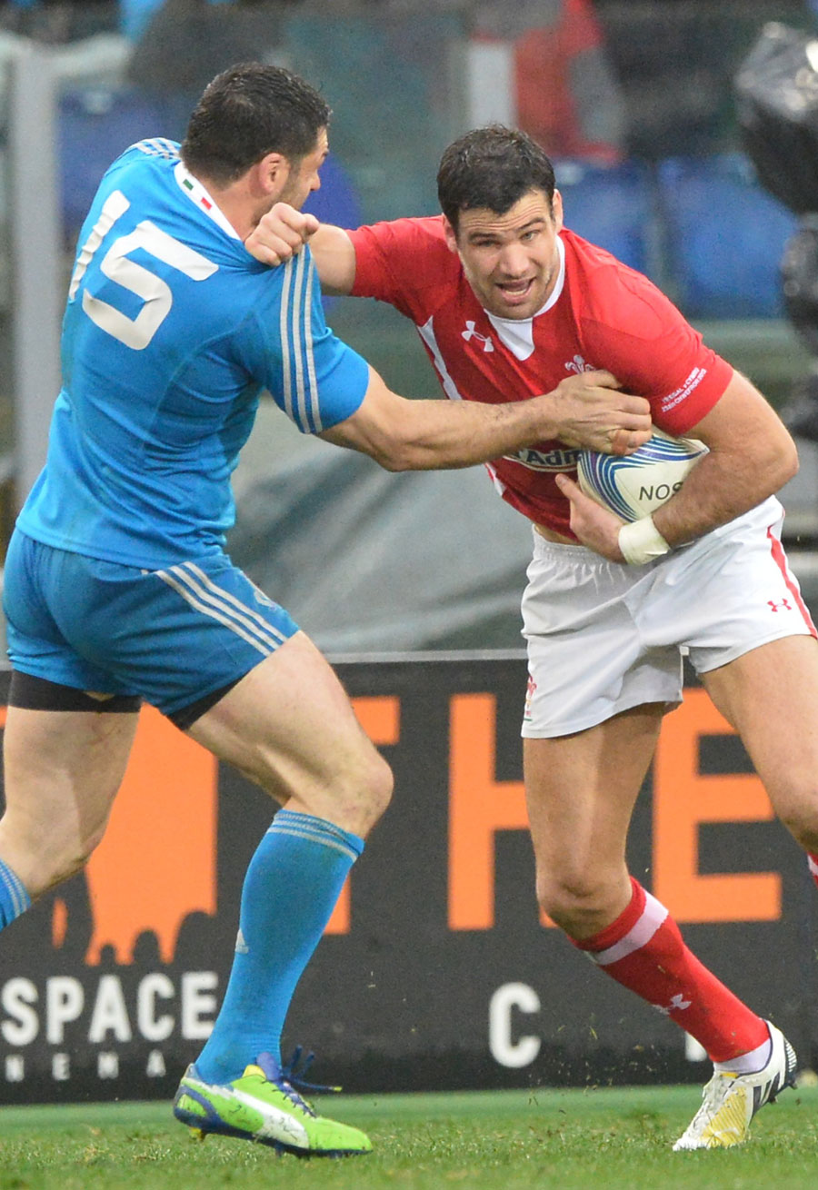 Wales' Mike Phillips fends off Italy's Andrea Masi