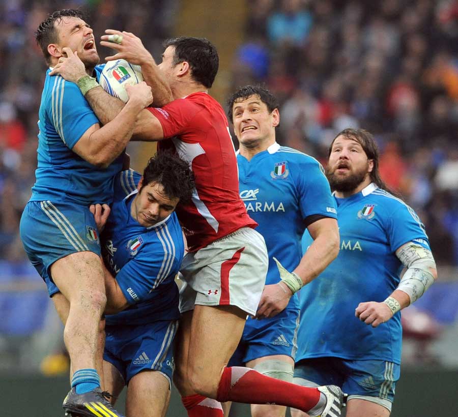 Wales' Mike Phillips clashes with Italy's Giovambattista Venditti 