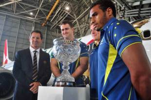 Australia's Robbie Deans, James Horwill, Michael Hooper and Will Genia pose with the Tom Richards Trophy, Sydney Airport, Sydney, Australia, February 25, 2013
