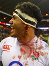 Bruised and battered England centre Manu Tuilagi savours victory