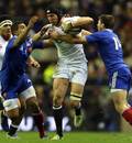 England's Tom Wood storms through the France defence