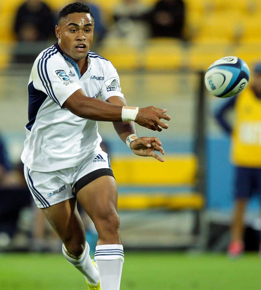 The Blues' Francis Saili passes the ball against the Hurricanes