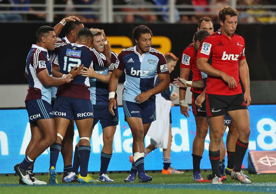 The Blues celebrate a try scored by Frank Halai against the Crusaders