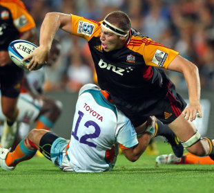 The Chiefs' Brodie Retallick off loads the ball in the tackle, Chiefs v Cheetahs, Super Rugby, Waikato Stadium, Hamilton, New Zealand, March 2, 2013