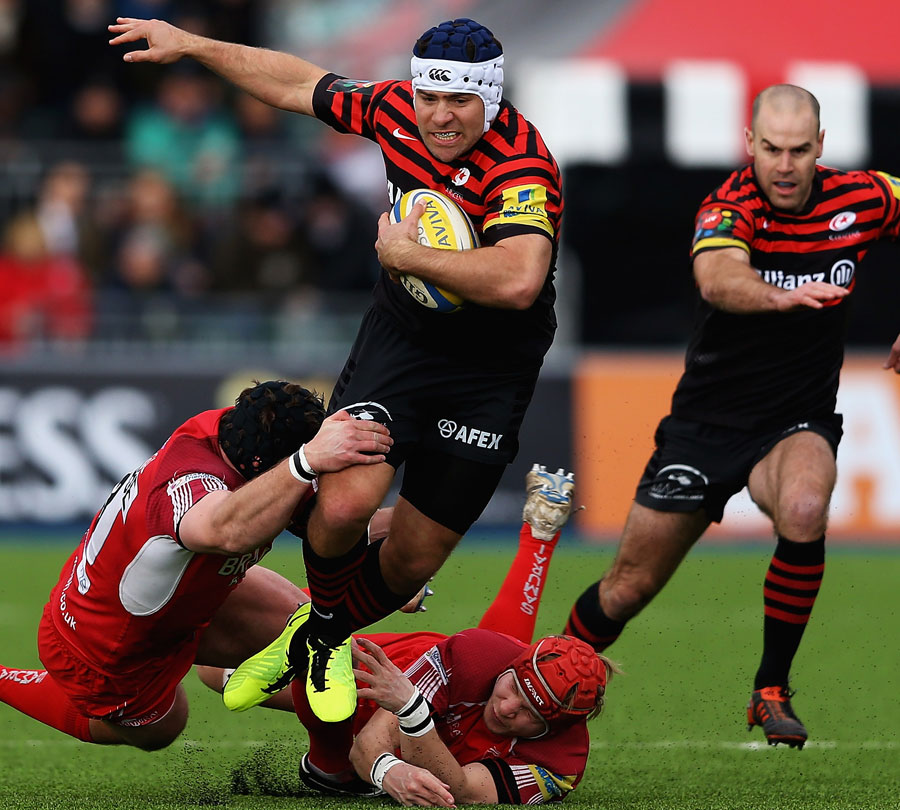 Saracens' Schalk Brits is caught by London Welsh defenders