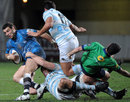 Referee Mathieu Raynal  is caught up with Montpellier and Racing Metro players