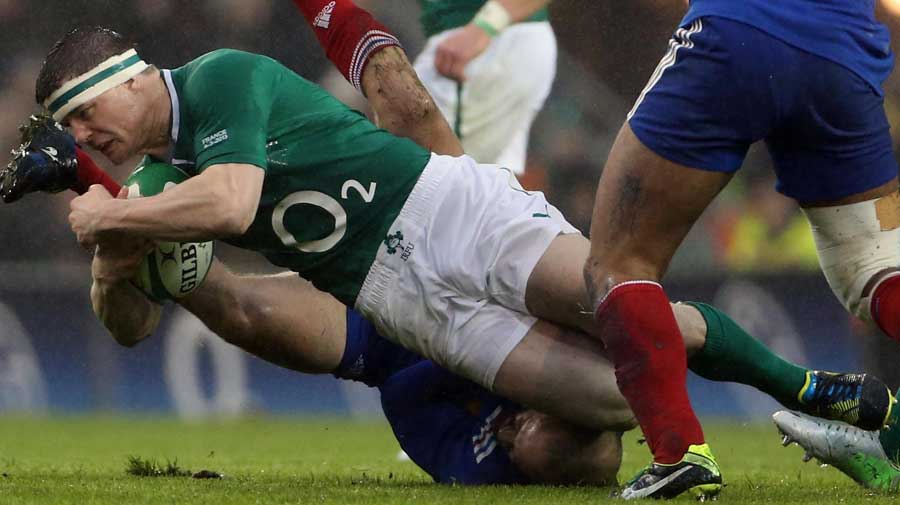 Ireland's Brian O'Driscoll is brought to the turf