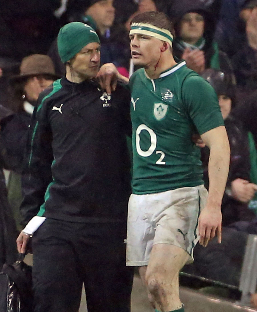 Ireland's Brian O'Driscoll is helped from the field