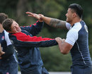 England's Alex Goode and Manu Tuilagi tussle with each other in training