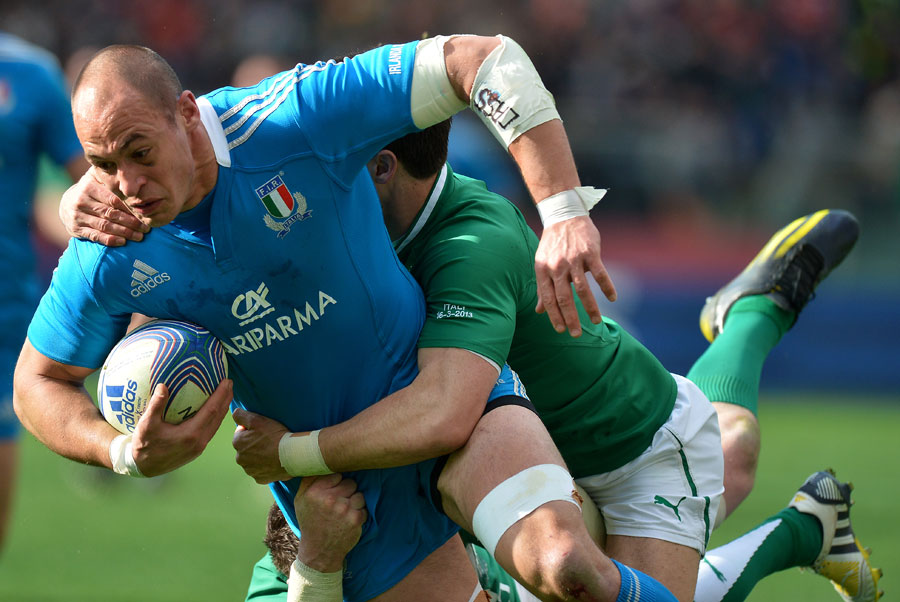 Italy's Sergio Parisse is hauled down by the Ireland defence