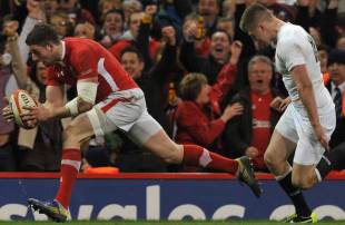 Wales' Alex Cuthbert sprints away from England's Owen Farrell to go over, Wales v England, Six Nations, Millennium Stadium, Cardiff, Wales, March 16, 2013