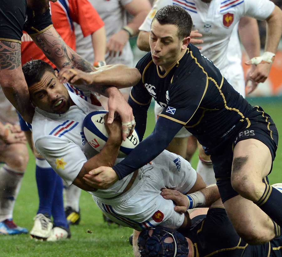 France's Wesley Fofana is brought to ground