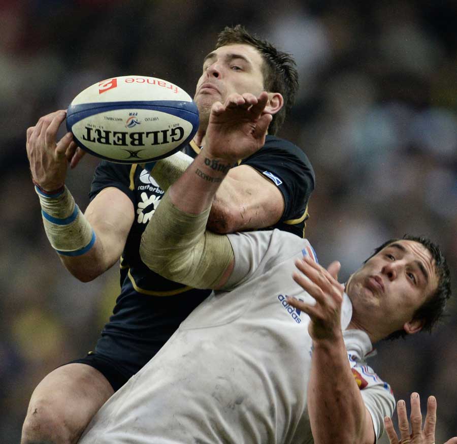 Scotland's Sean Lamont and France's Louis Picamoles vie for the high ball
