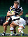 Sale's Andy Powell soaks up a tackle from Quins' Ben Botica