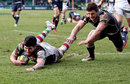 Quins' Tom Casson slides in to score a try