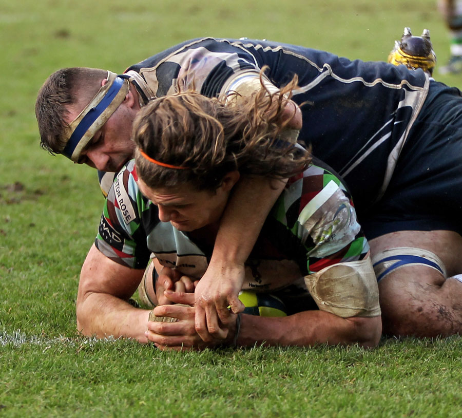 Quins' Luke Wallace muscles his way over for a try