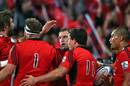 The Crusaders' George Whitelock (centre) celebrates a try against the Kings