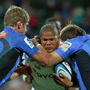 The Cheetahs' Ryno Benjamin is challenged by Force's Kyle Godwin and Will Tupou