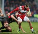 Gloucester's Jonny May jinks his way through the London Welsh defence