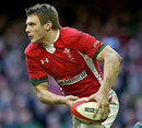 Wales' Dan Biggar looks to shift the ball