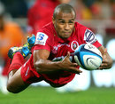 The Reds' Will Genia shifts the ball