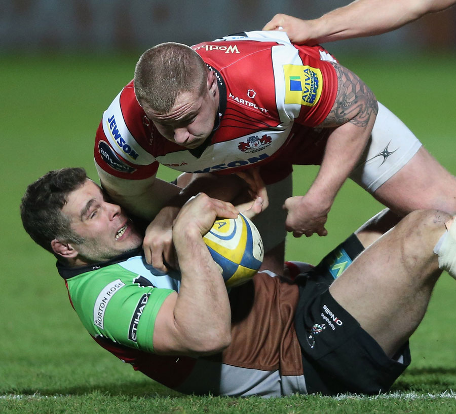 Harlequins' Nick Easter competes for the ball with Gloucester's Koree Britton
