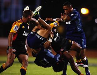 The Blues' Rene Ranger is upended by the Chiefs' Bundee Aki, Chiefs v Blues, Super Rugby, Baypark Stadium, Mount Maunganui, March 30, 2013