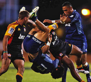 The Blues' Rene Ranger is upended by the Chiefs' Bundee Aki, Chiefs v Blues, Super Rugby, Baypark Stadium, Mount Maunganui, March 30, 2013