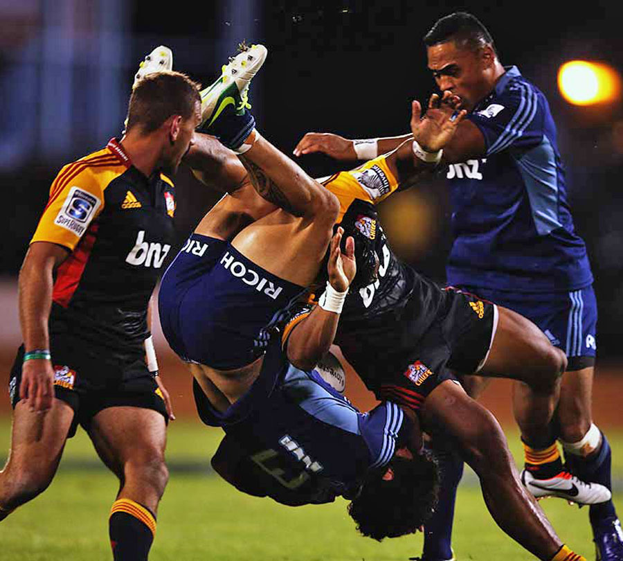 The Blues' Rene Ranger is upended by the Chiefs' Bundee Aki,