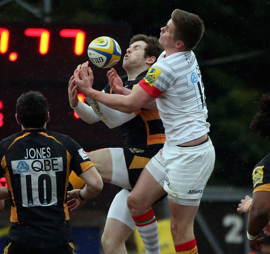 London Wasps' Elliot Daly (left) challenges Saracens' Owen Farrell for the high ball 