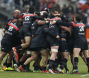 Toulouse players celebrate their late win over Racing Metro
