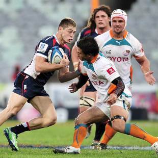 Melbourne Rebels' James O'Connor (l) runs the ball, Cheetahs v Melbourne Rebels, Super Rugby, Free State Stadium, Bloemfontein, March 30, 2013