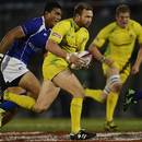Australia's James Stannard takes on the Samoa defence