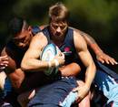 The Waratahs' Drew Mitchell takes the ball into contact